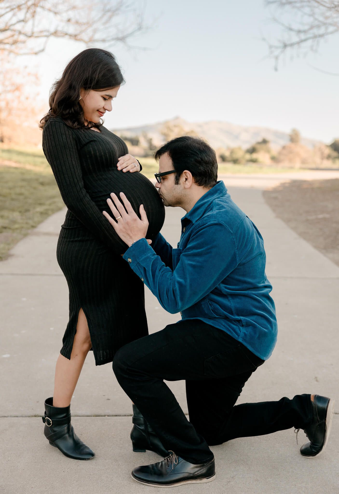 Candid family moment during maternity photography session in Fremont nature trail