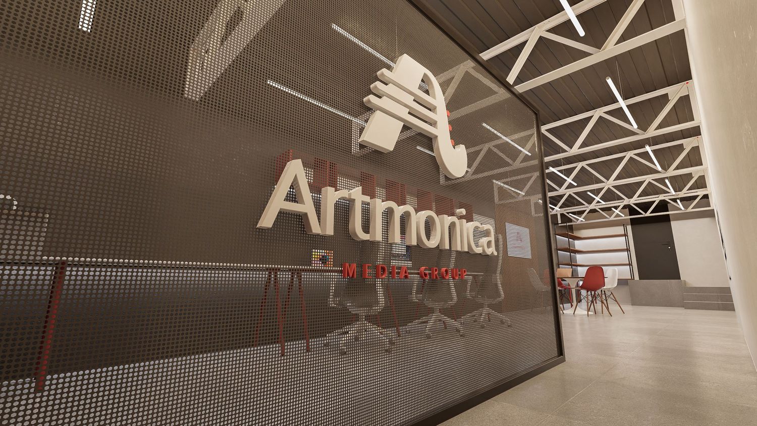 Modern studio interior with Artmonia signage on wall in a minimalist industrial space.
