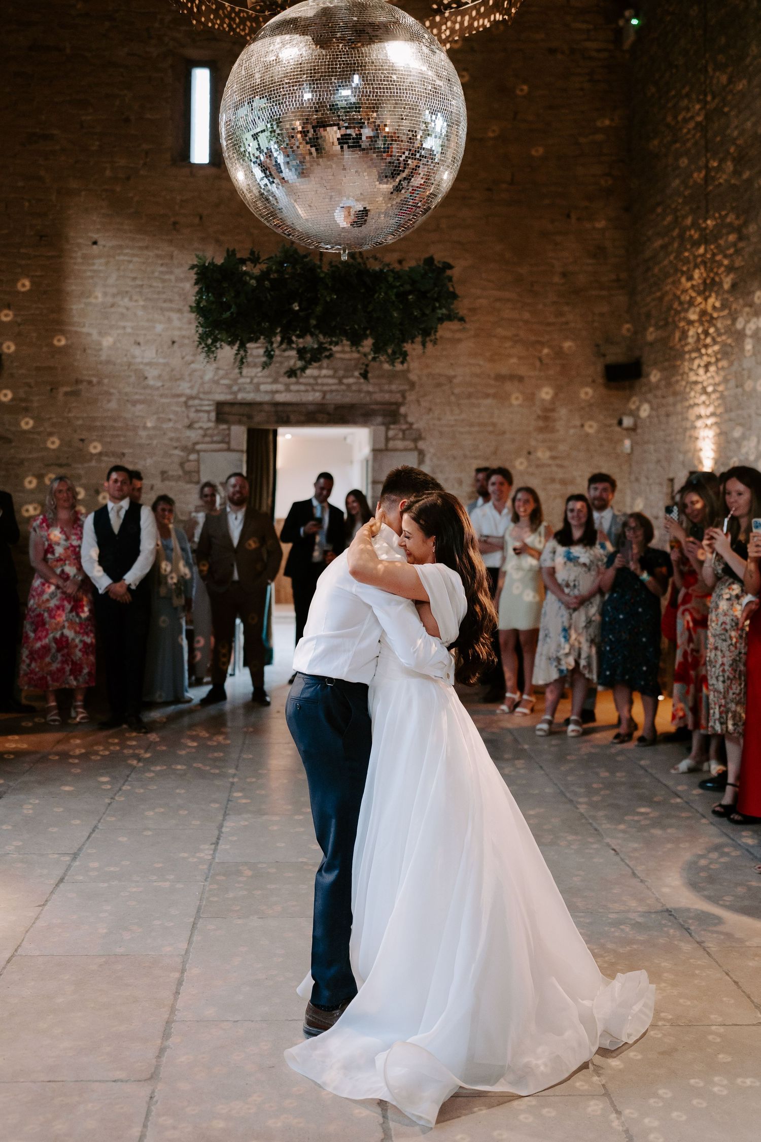 bride and groom dancing at yardspace old gore in cirencester