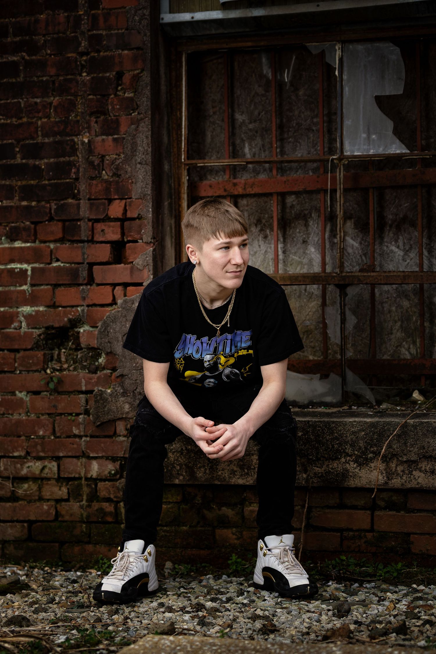 Lifestyle senior portrait for a high school student in a rustic, industrial Lincoln, Alabama setting.