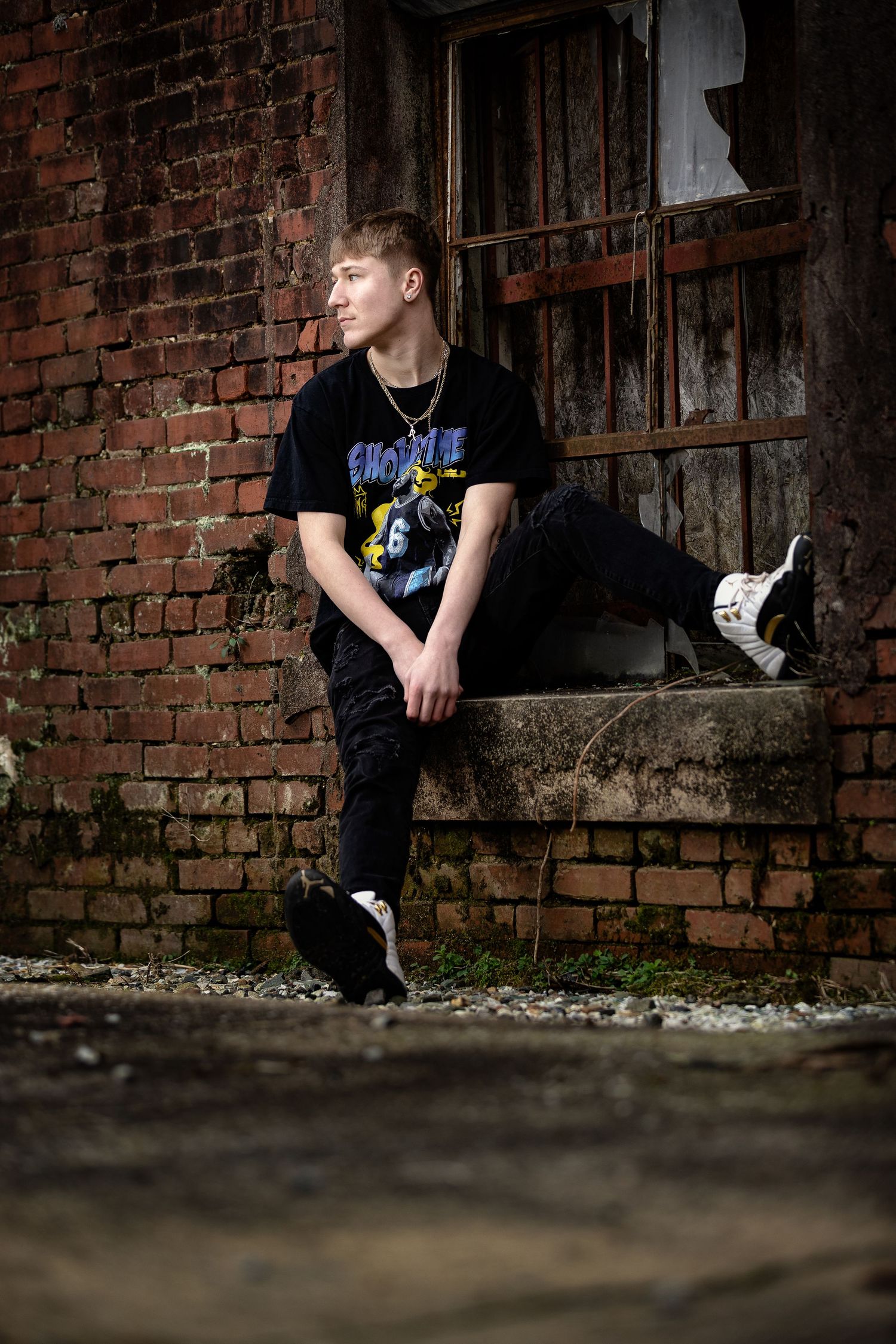Lifestyle senior portrait for a high school student in a rustic, industrial Lincoln, Alabama setting.