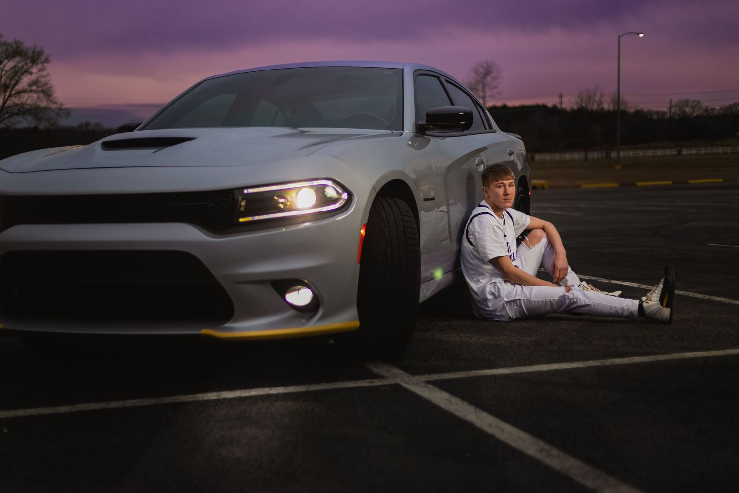 Lincoln, Alabama senior portrait featuring a high school student with his car at dusk.