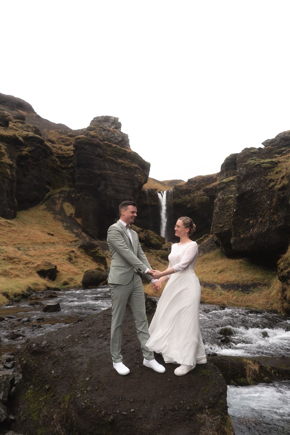 Couple standing in front of Kvernufoss