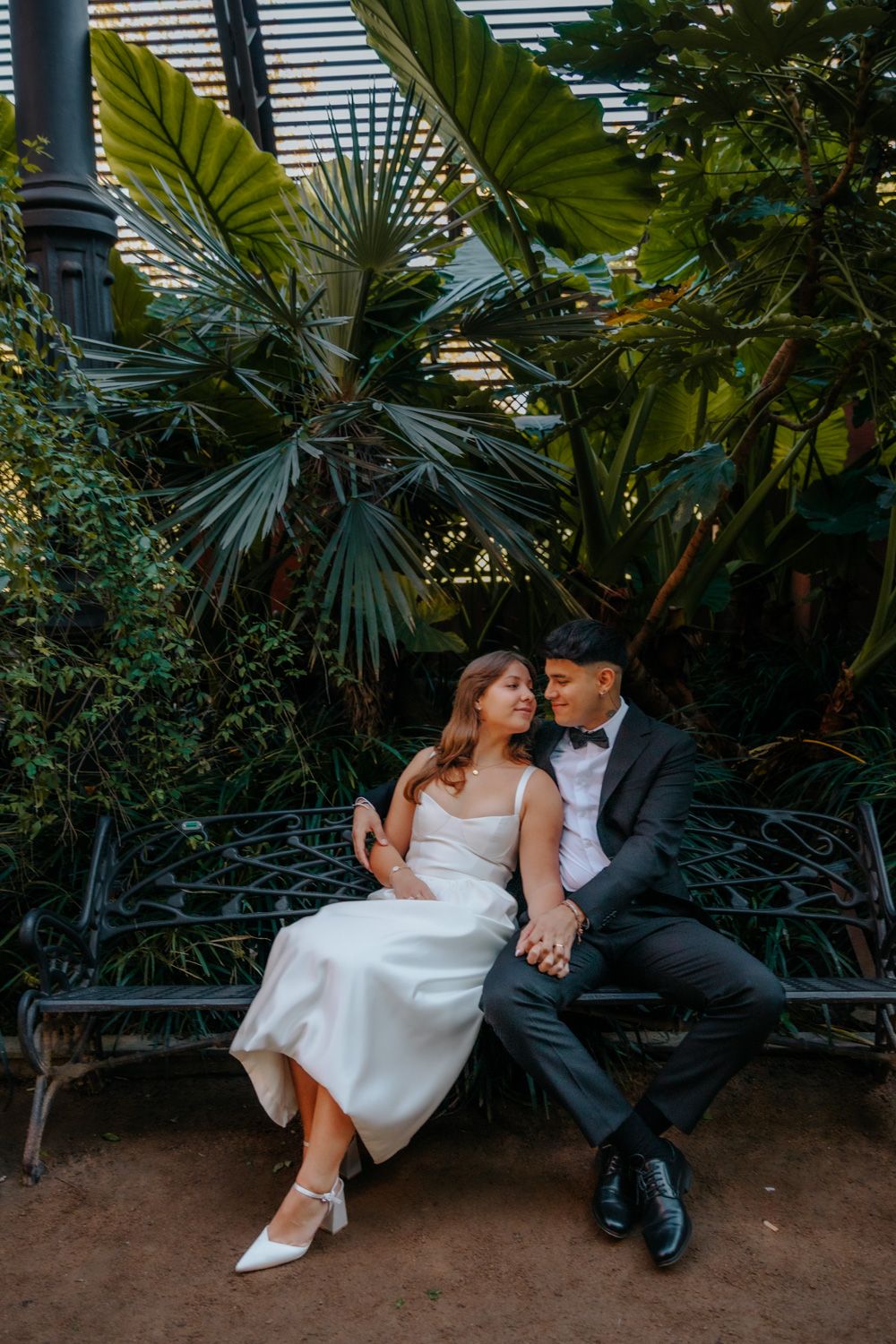 Intimate hug under iron arches Umbracle Barcelona couples photography BarcelonaLoversPH