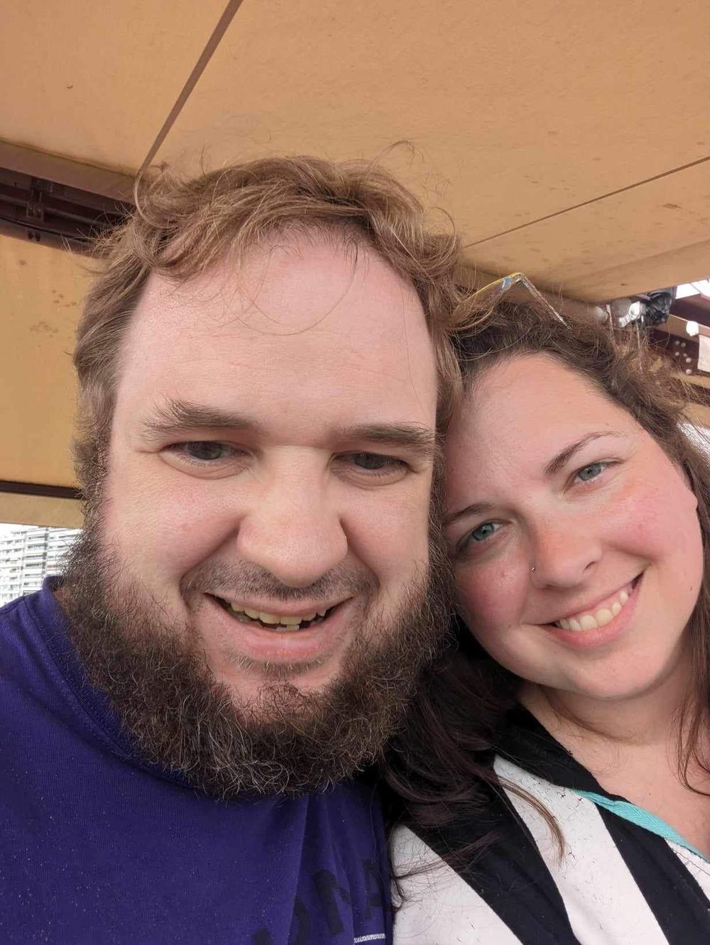 A smiling couple takes a series of selfies together showing their happy expressions and close bond.
