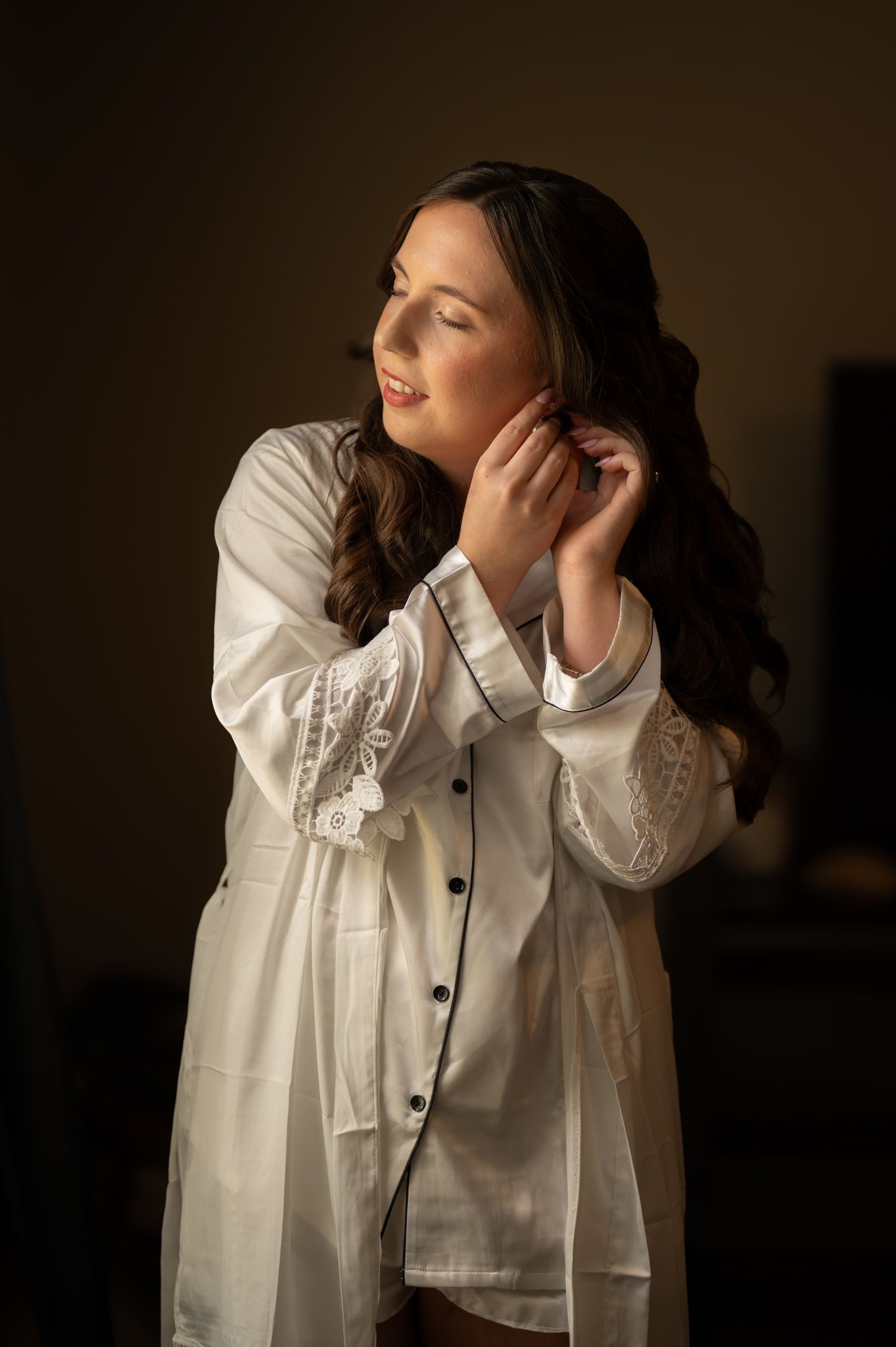 Artistic portrait series in white button-down shirt against dark background.