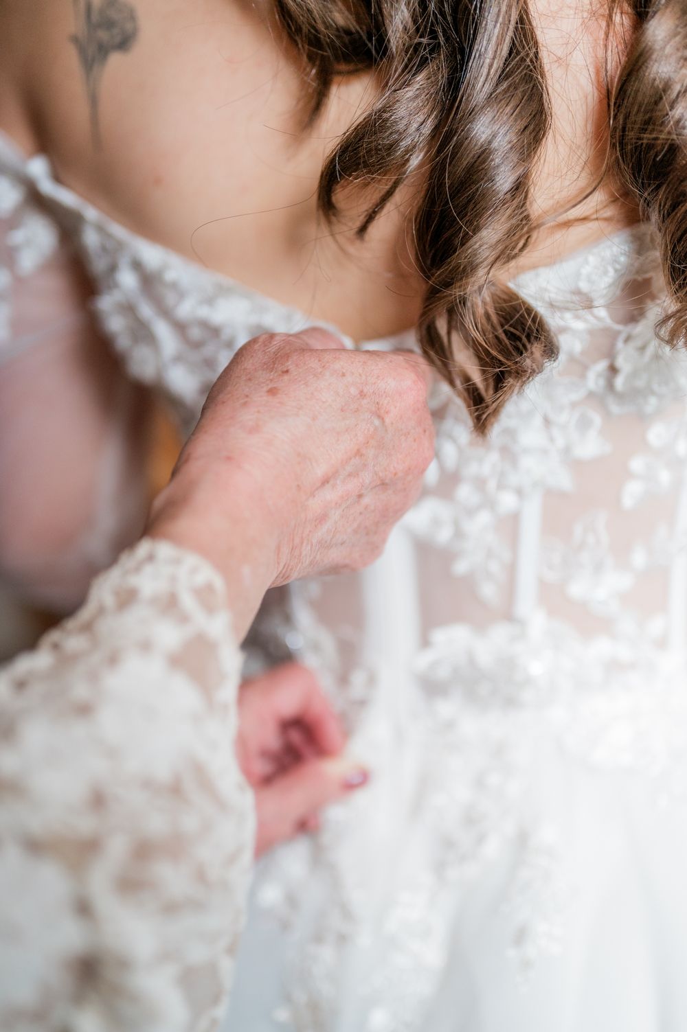 Close-up sequence of a romantic wedding kiss with delicate white lace details.