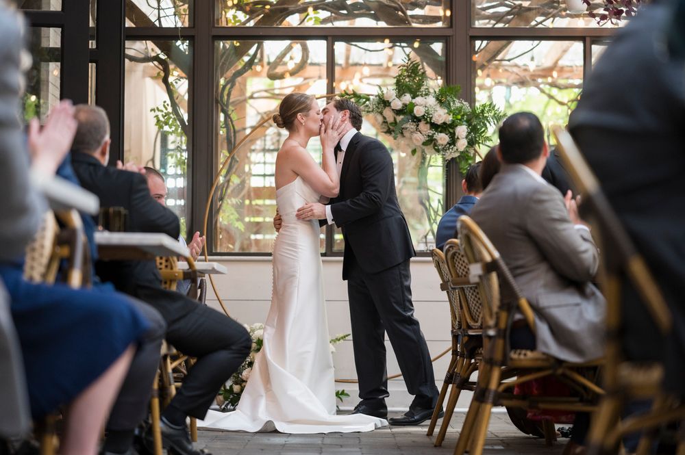Multiple views of a wedding ceremony in progress at an indoor venue with rustic wooden decor and natural light.