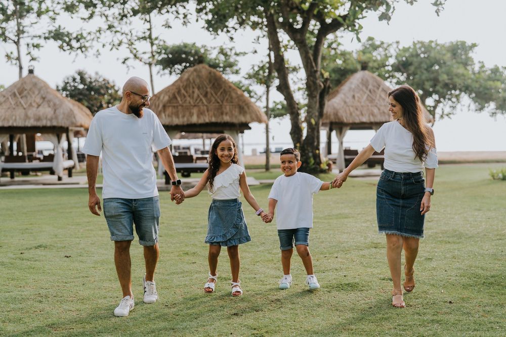 Professional family photoshoot service with beach and ocean background.