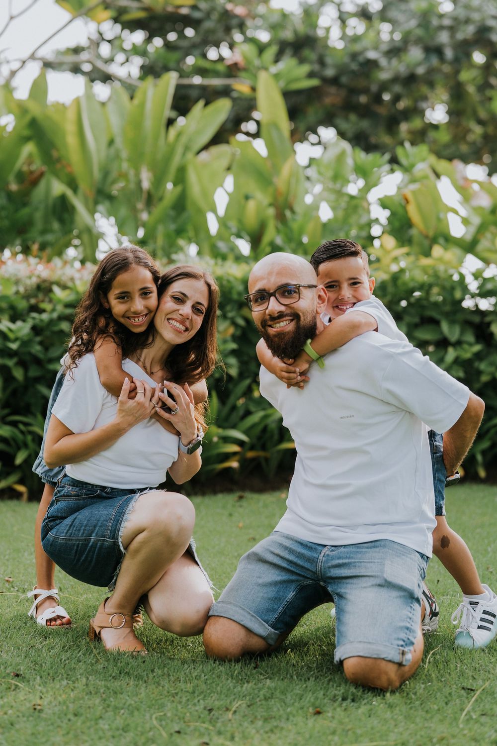 Professional family photoshoot service with beach and ocean background.