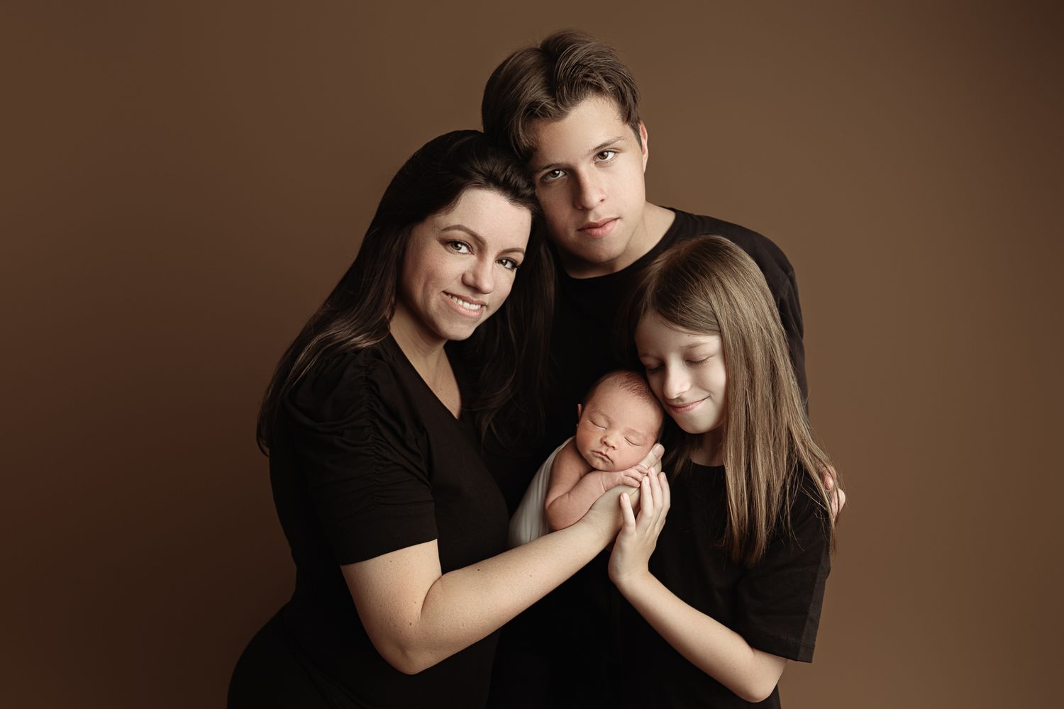 Group photo at night in front of illuminated Bellagio Hotel in Las Vegas. – newborn photographer Paloma Schell Houston TX