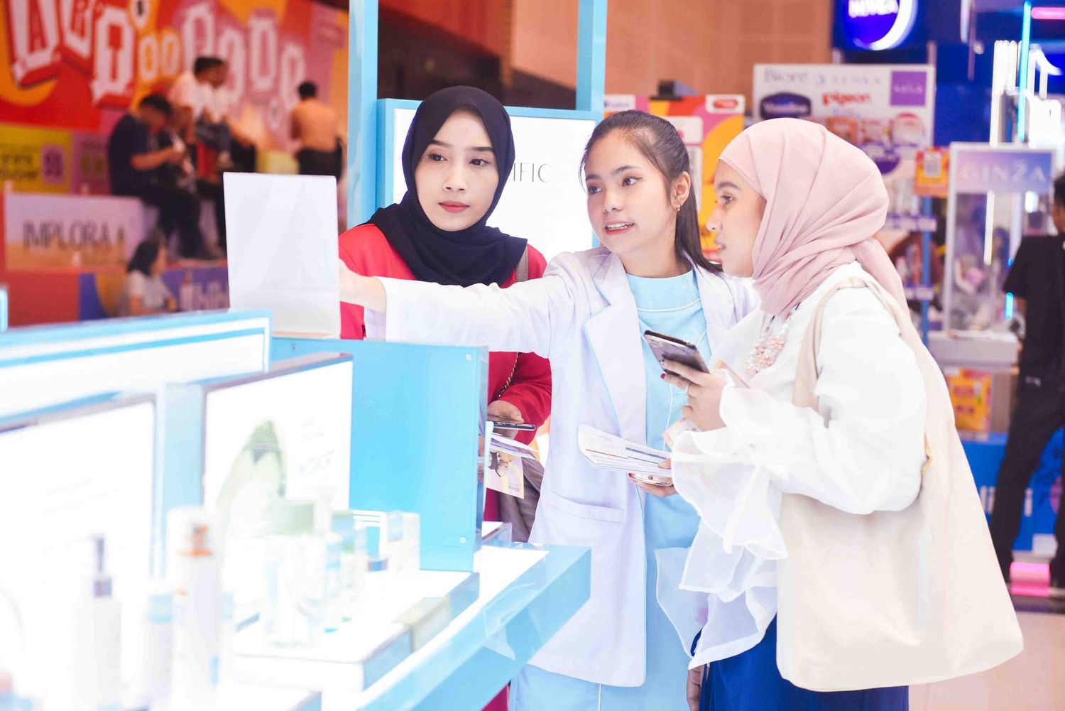 Customers browse and shop at a brightly lit cosmetics and beauty store with white counters and product displays.