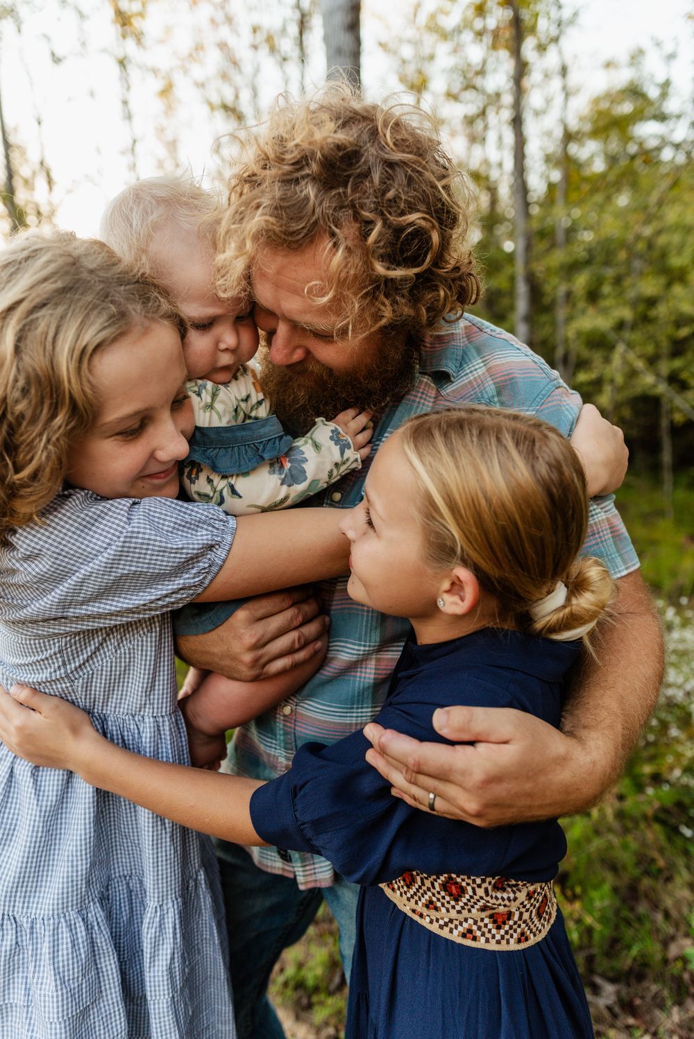 Memphis Family Portrait of father and daughters on farm in Collierville, Tennessee during golden hour.