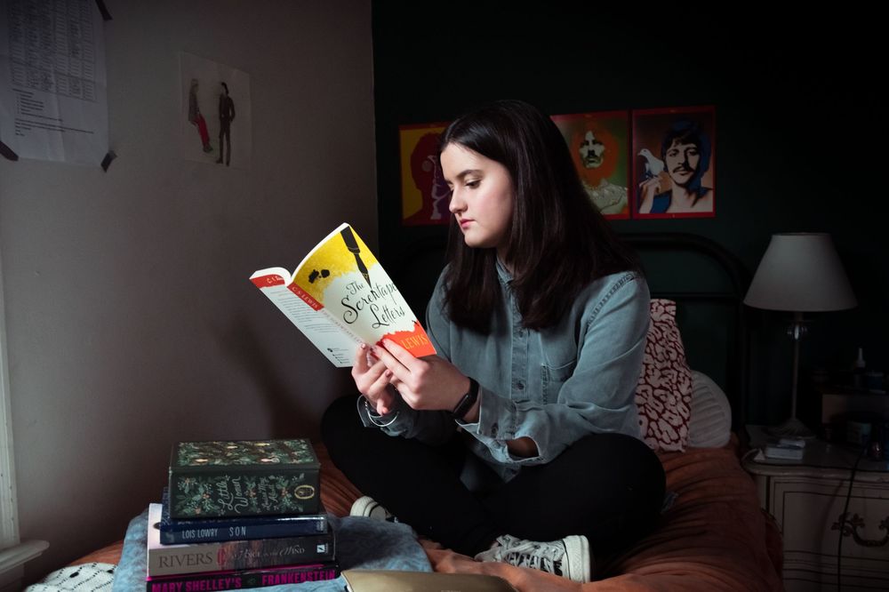 Memphis Family Documentary session girl reading CS Lewis.