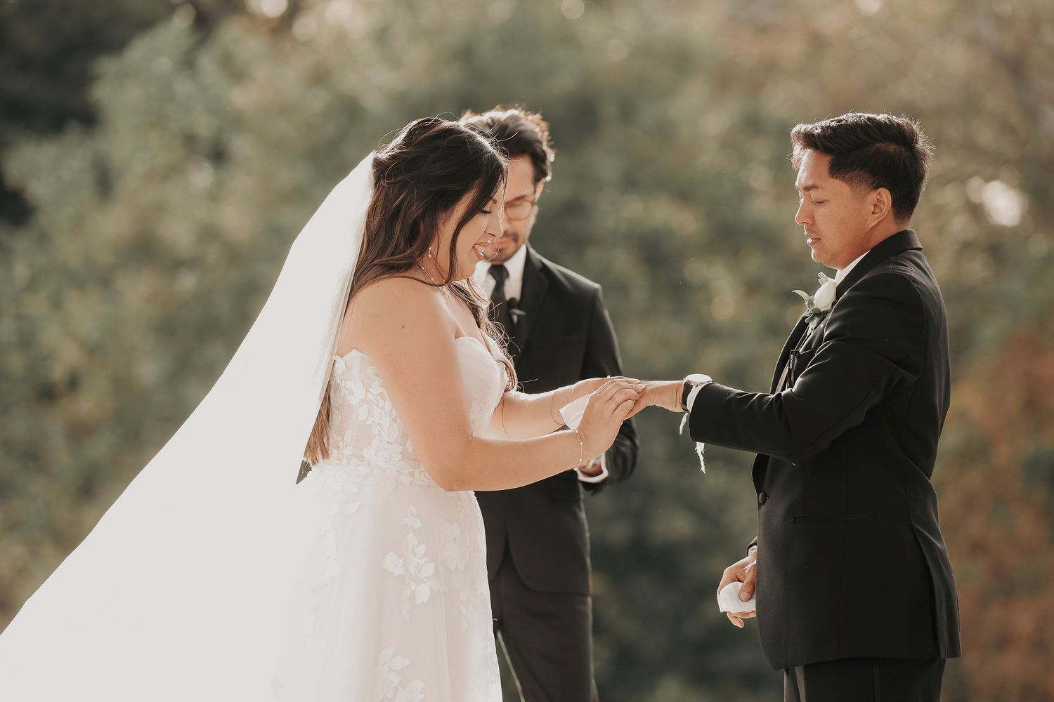 Wedding ring exchange captured during ceremony in dallas