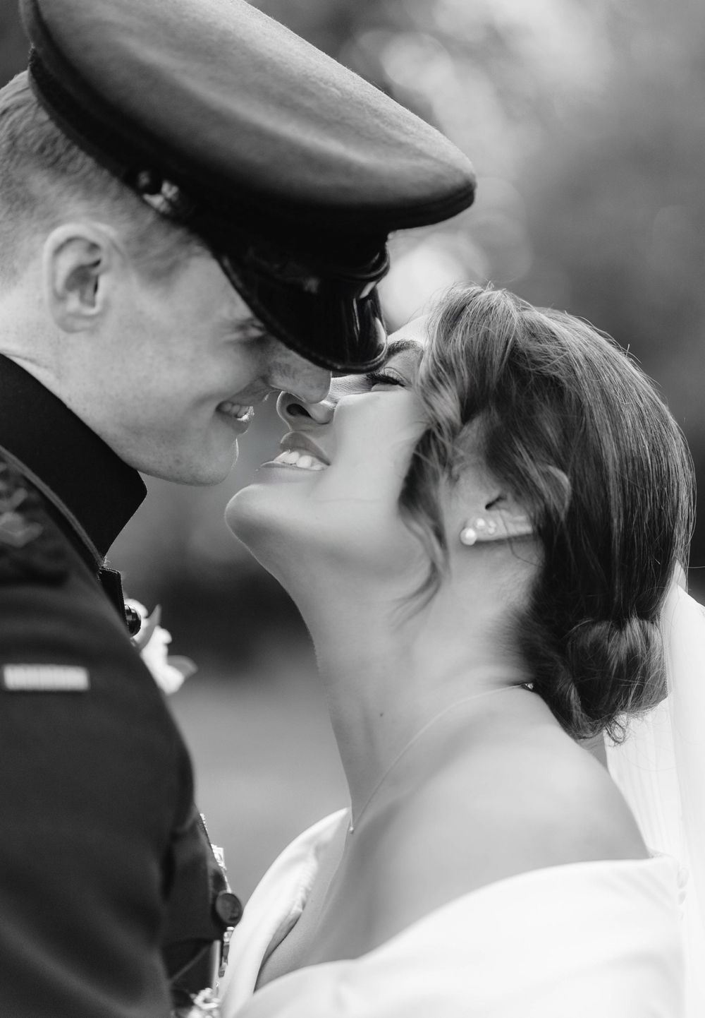 A romantic black and white photo series showing a couple kissing in four sequential frames.
