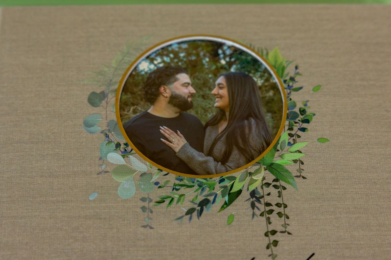 A rustic wooden background with circular decorative watercolor elements and foliage designs along the border.