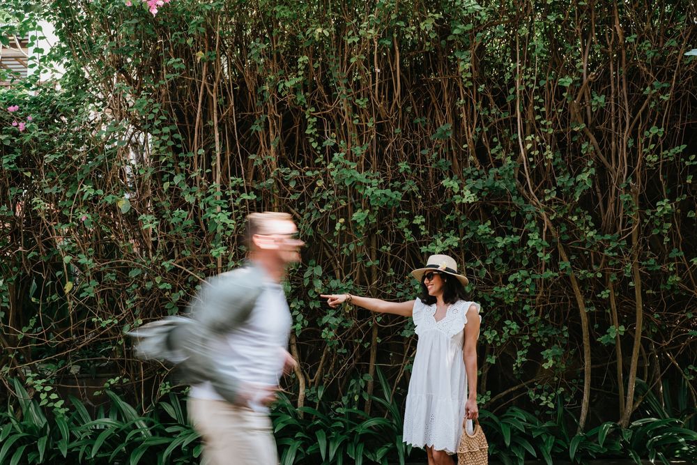 A playful moment captured in a lush garden with motion blur.