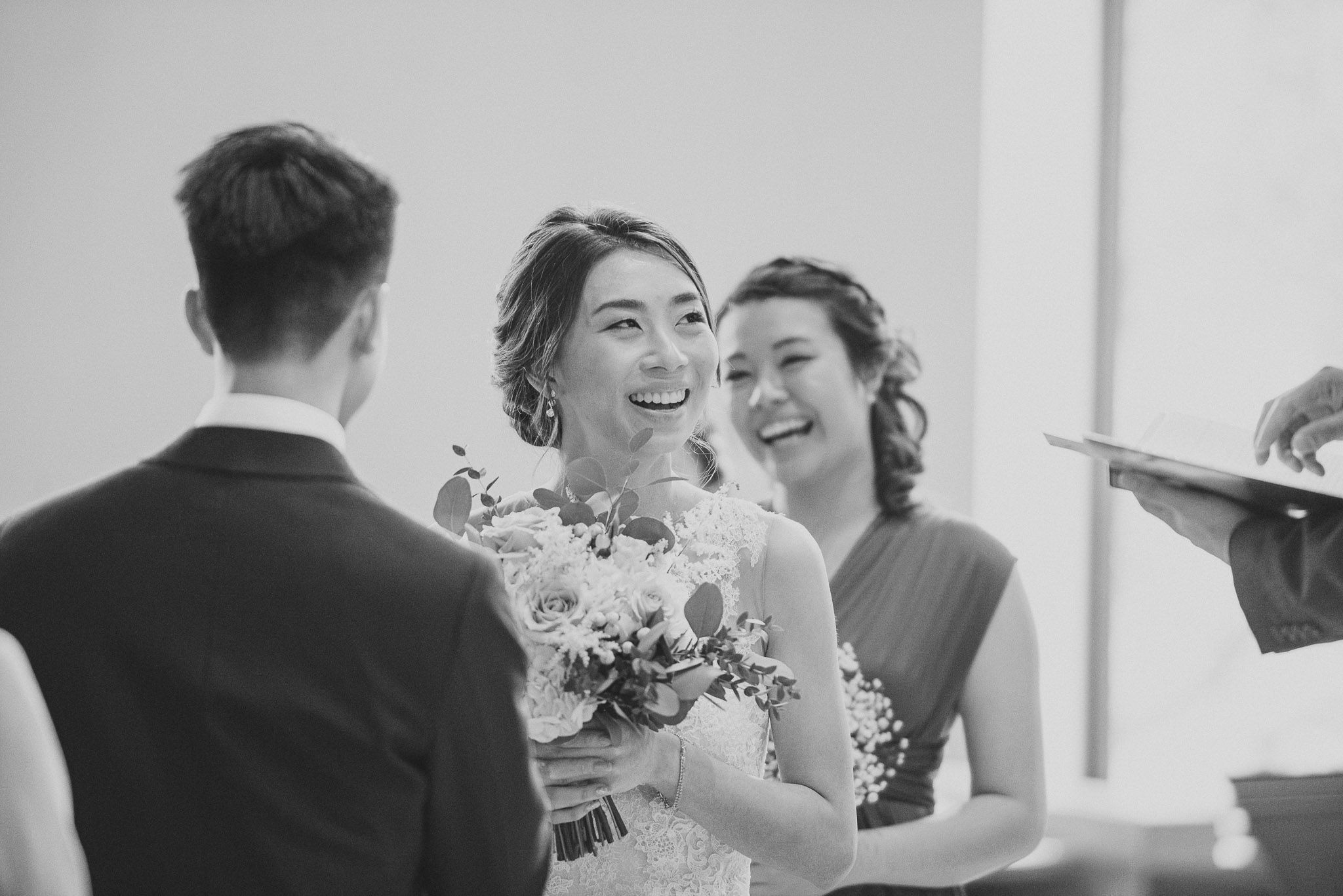 Wedding ceremony moments captured in black and white showing emotional reactions.