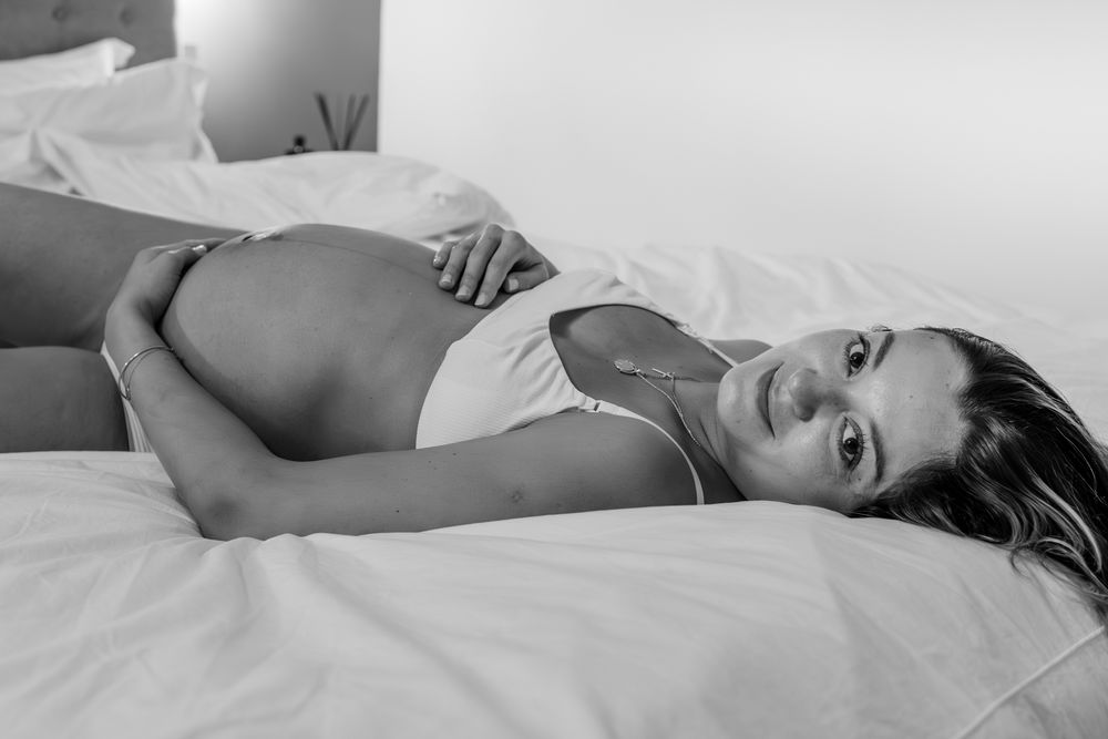 Serene maternity boudoir photos capturing peaceful moments during pregnancy.