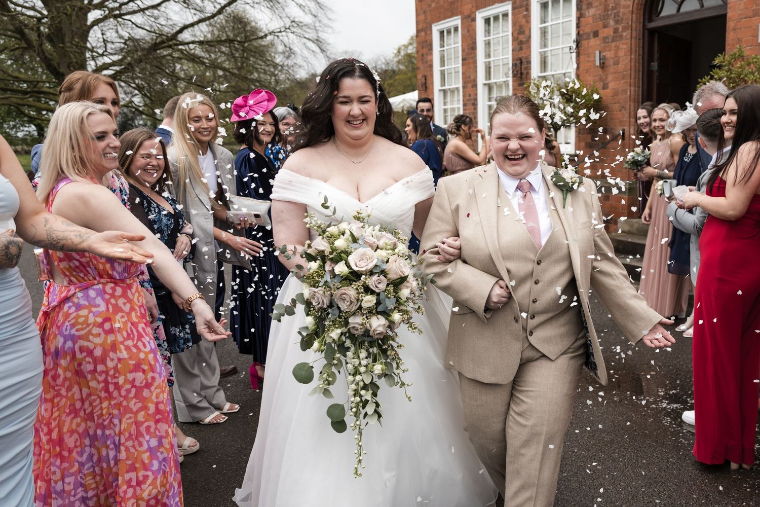 Bride & Bride at Kelham House, natural candid confetti photo.