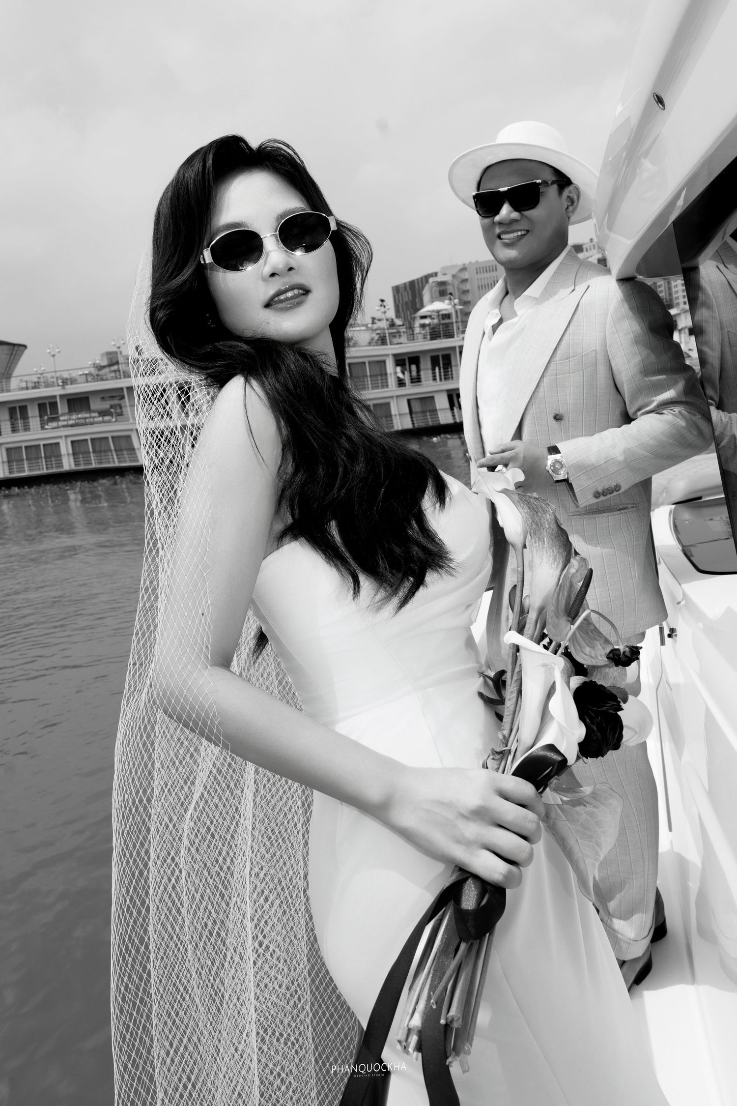alt="Couple prewedding photoshoot at harbor & yachts"