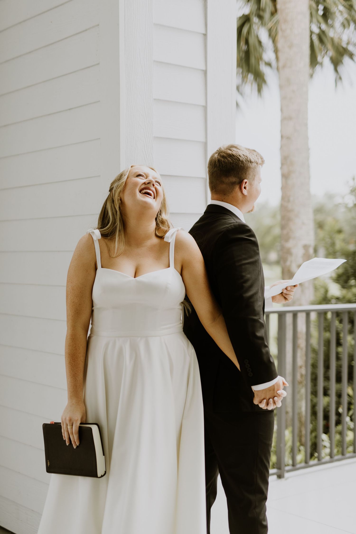Bride and groom first touch and scripture reading from Tradition Town Hall wedding in the summer captured by Lindsay McDow Photography.