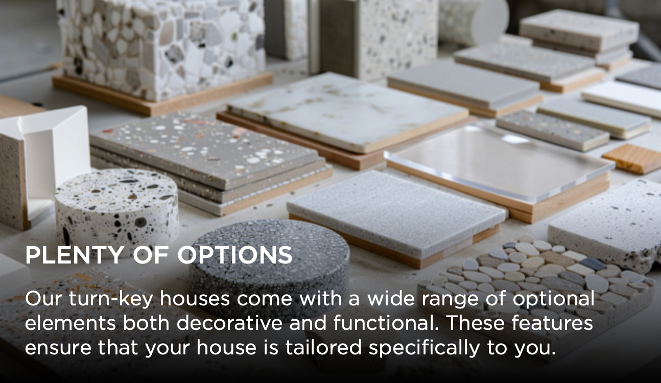 Modern home design display showing customizable decorative elements and finishes arranged on wooden platforms.