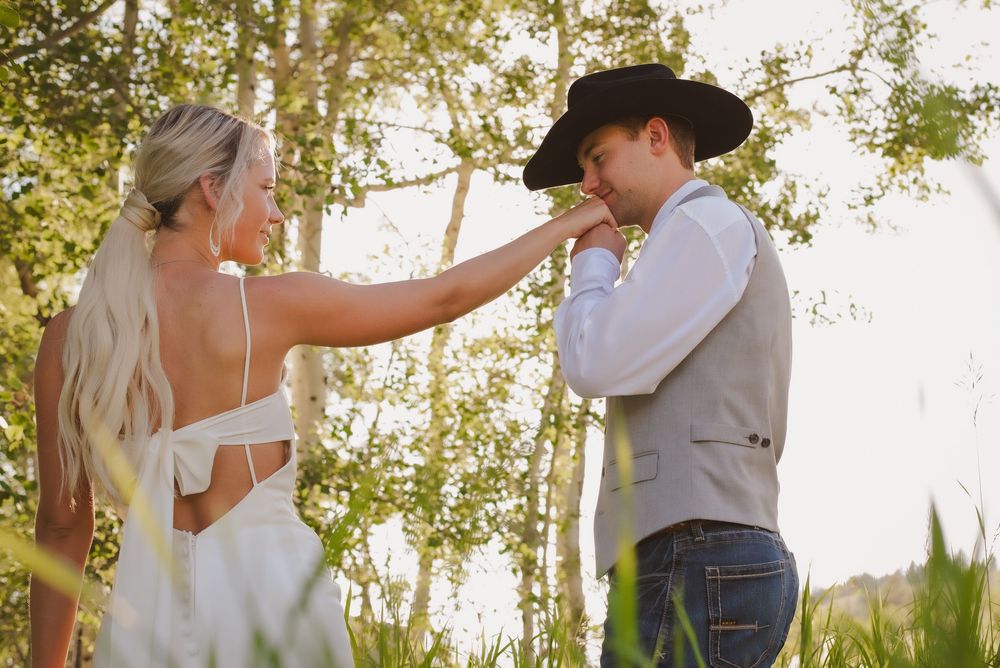Romantic wedding portraits in golden sunlight with aspen trees.
