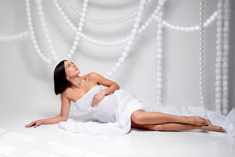 Fine art maternity photography with minimalistic background.