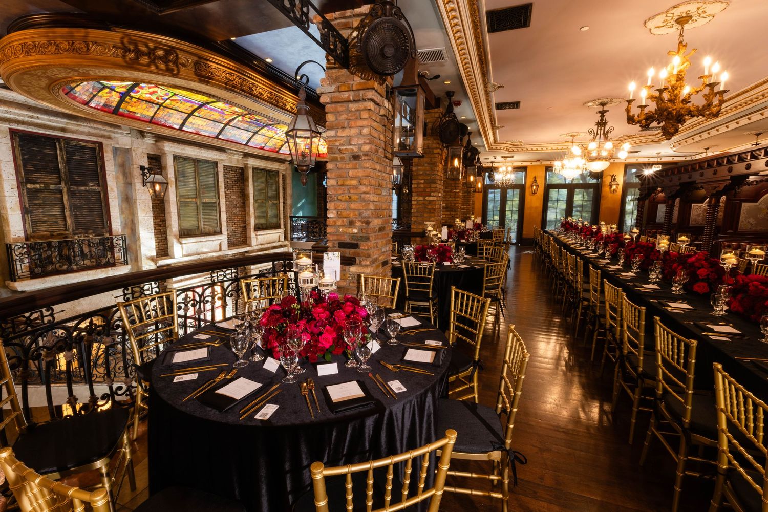 Elegant bistro interior with warm lighting, exposed brick walls, ornate chandeliers and cozy dining tables creates ambiance.