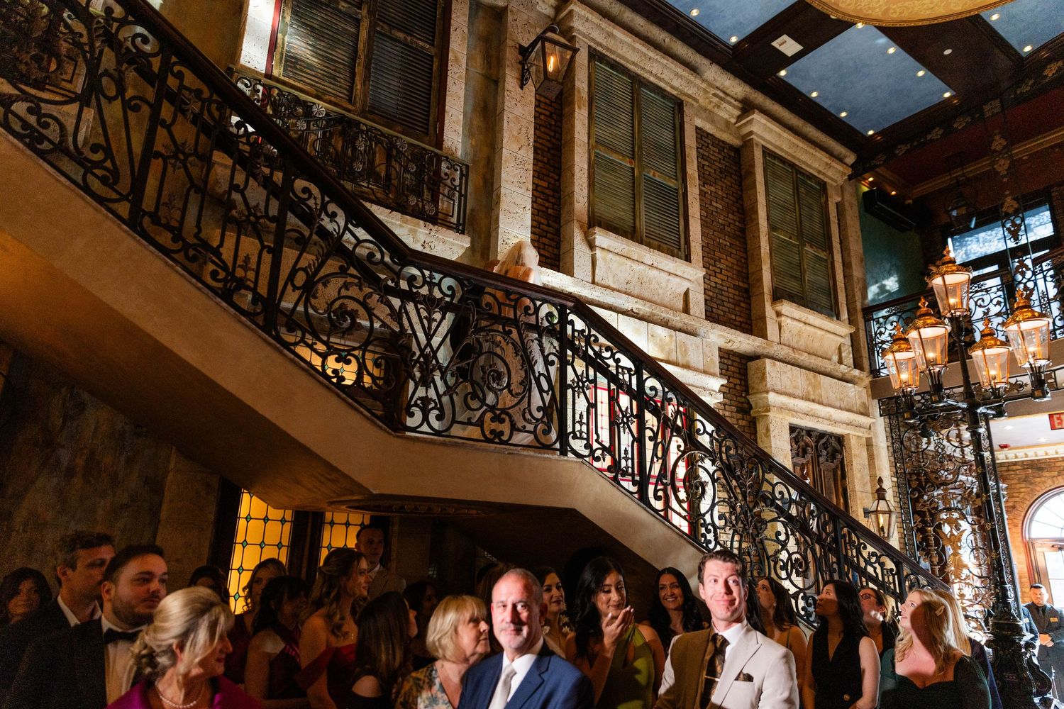 Interior architecture detail of an elegant venue with ornate railings and high ceilings.