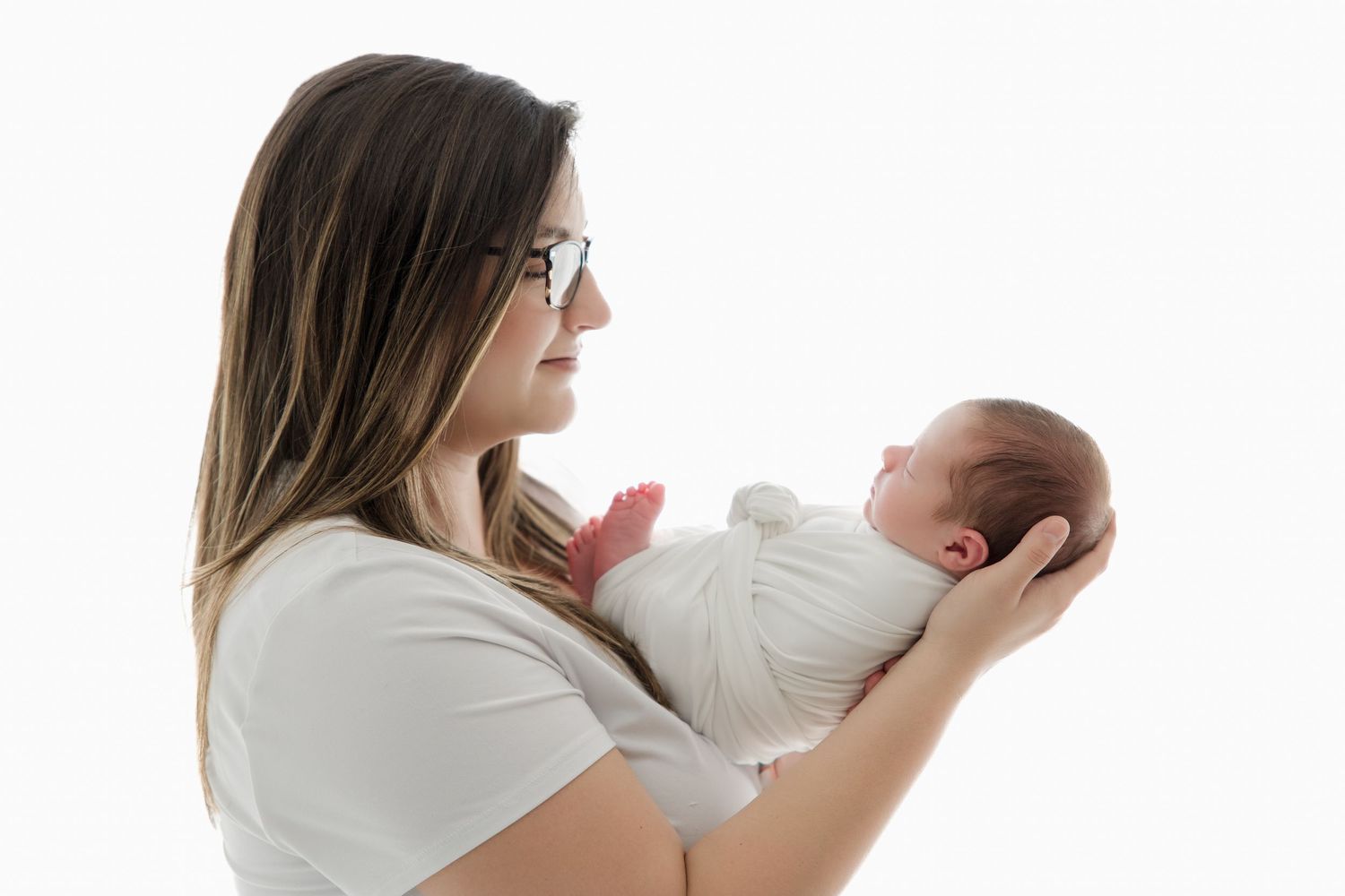 A series of three connected photos showing someone holding and feeding a baby in progressive stages.