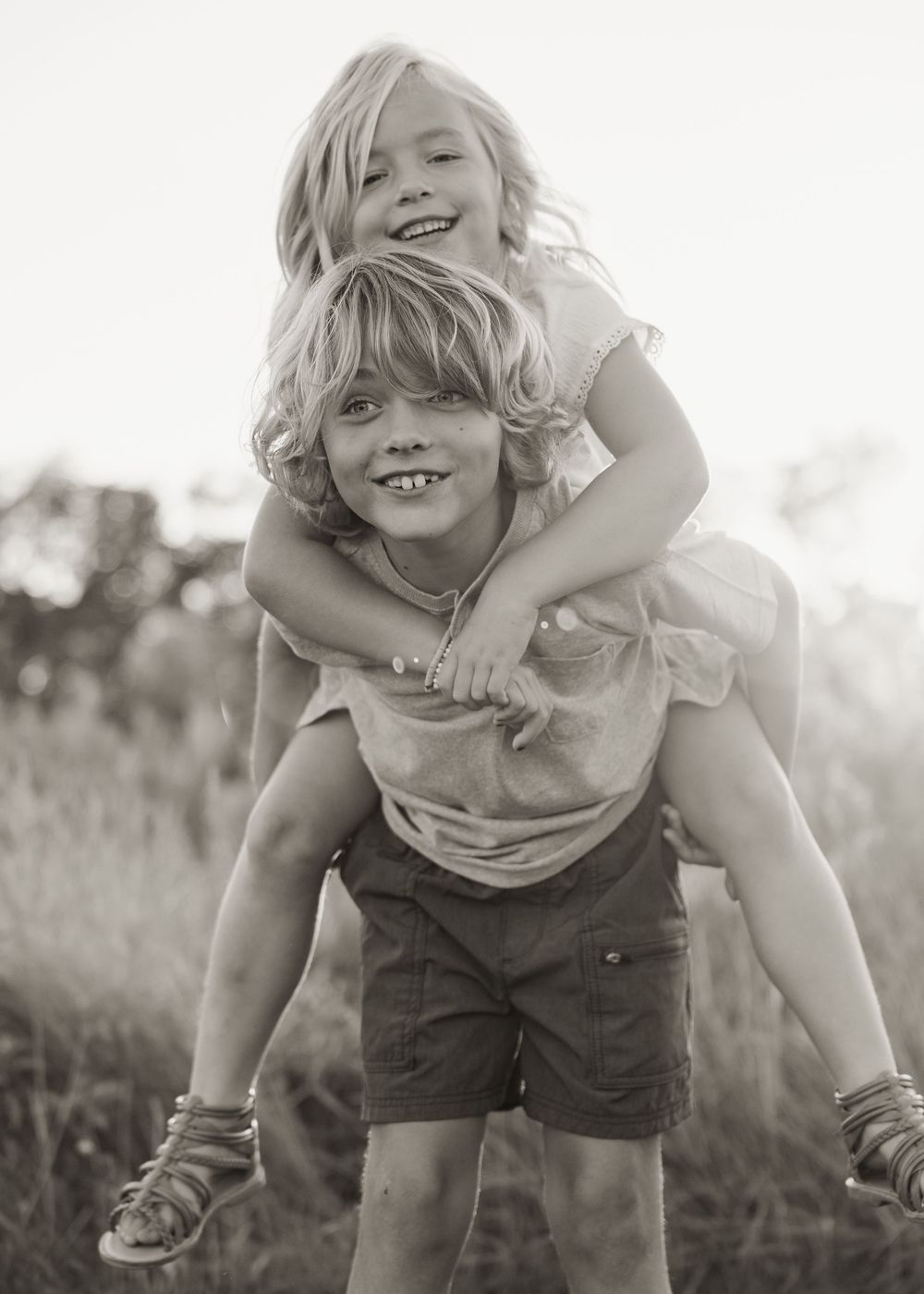 Black and white sequence of joyful outdoor play and movement.