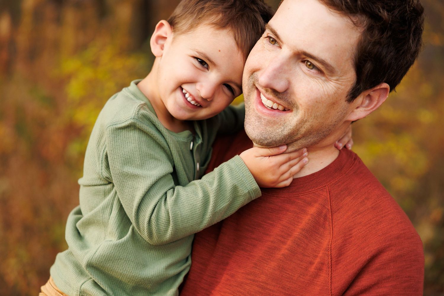 A heartwarming moment between parent and child showing affection and laughter.