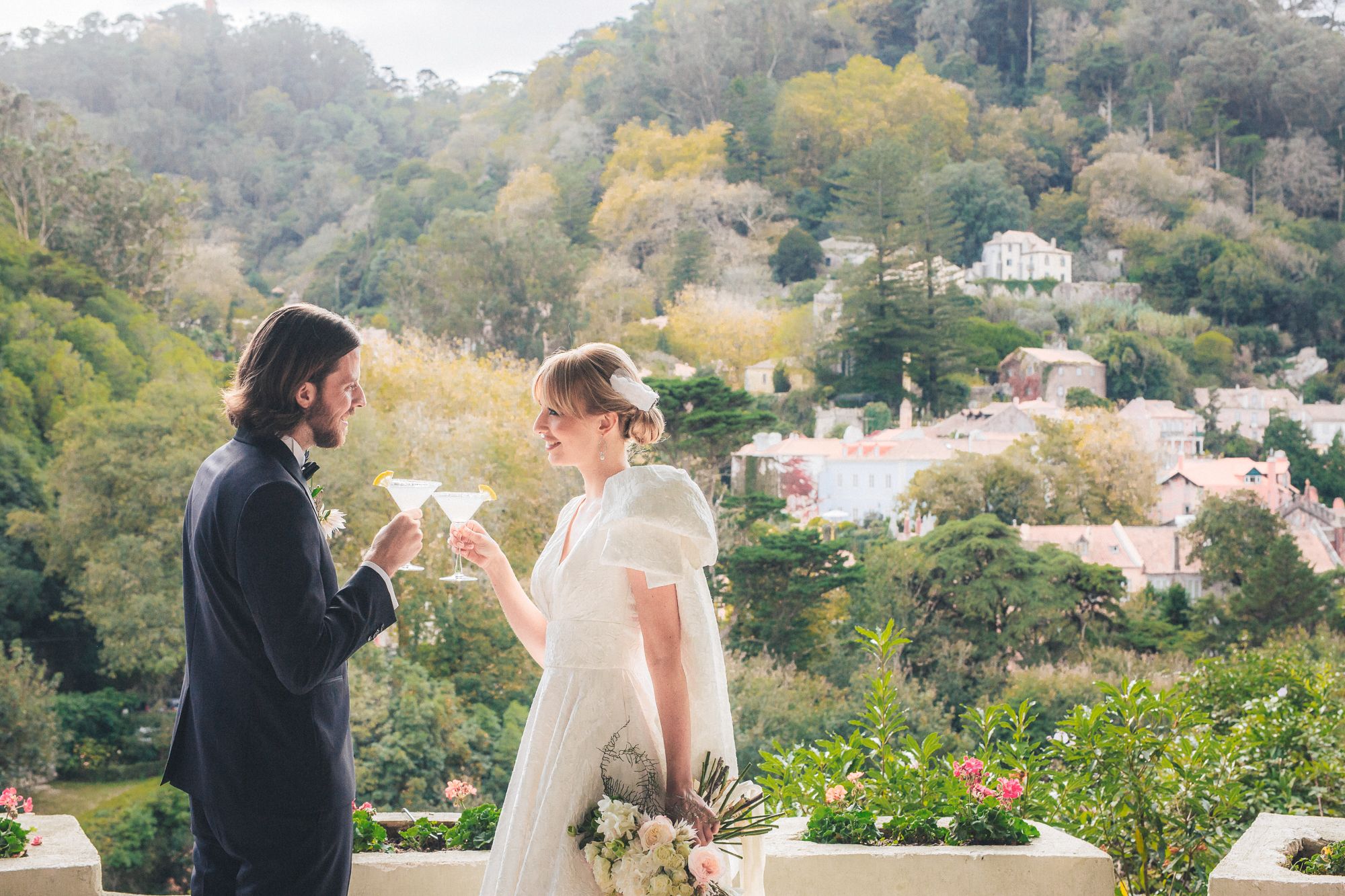 A wedding couple sharing a special moment Camelias garden. Captured in Portugal by a destination wedding photographer.