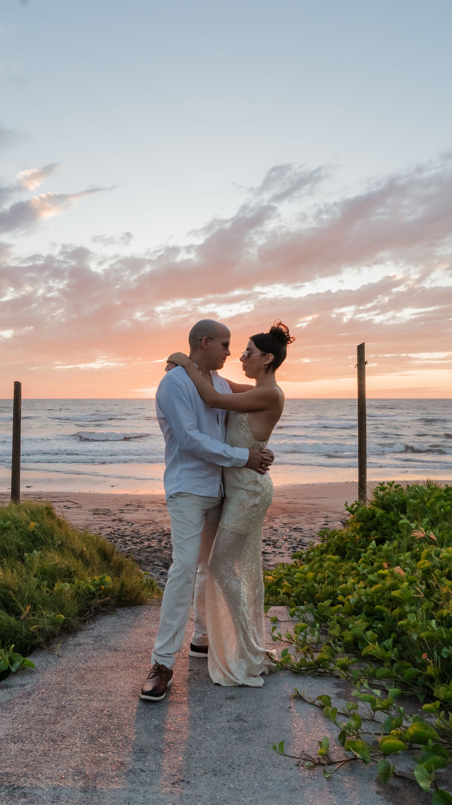 Bride and groom embracing with ocean view in Cabo San Lucas