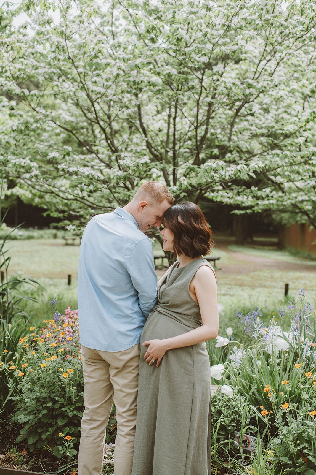 Smiling couple exploring a Tokyo garden during a photoshoot