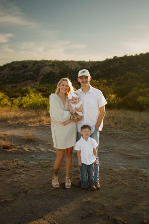 A family of four during a family photo session at Palo Duro Canyon State Park in Canyon, Texas