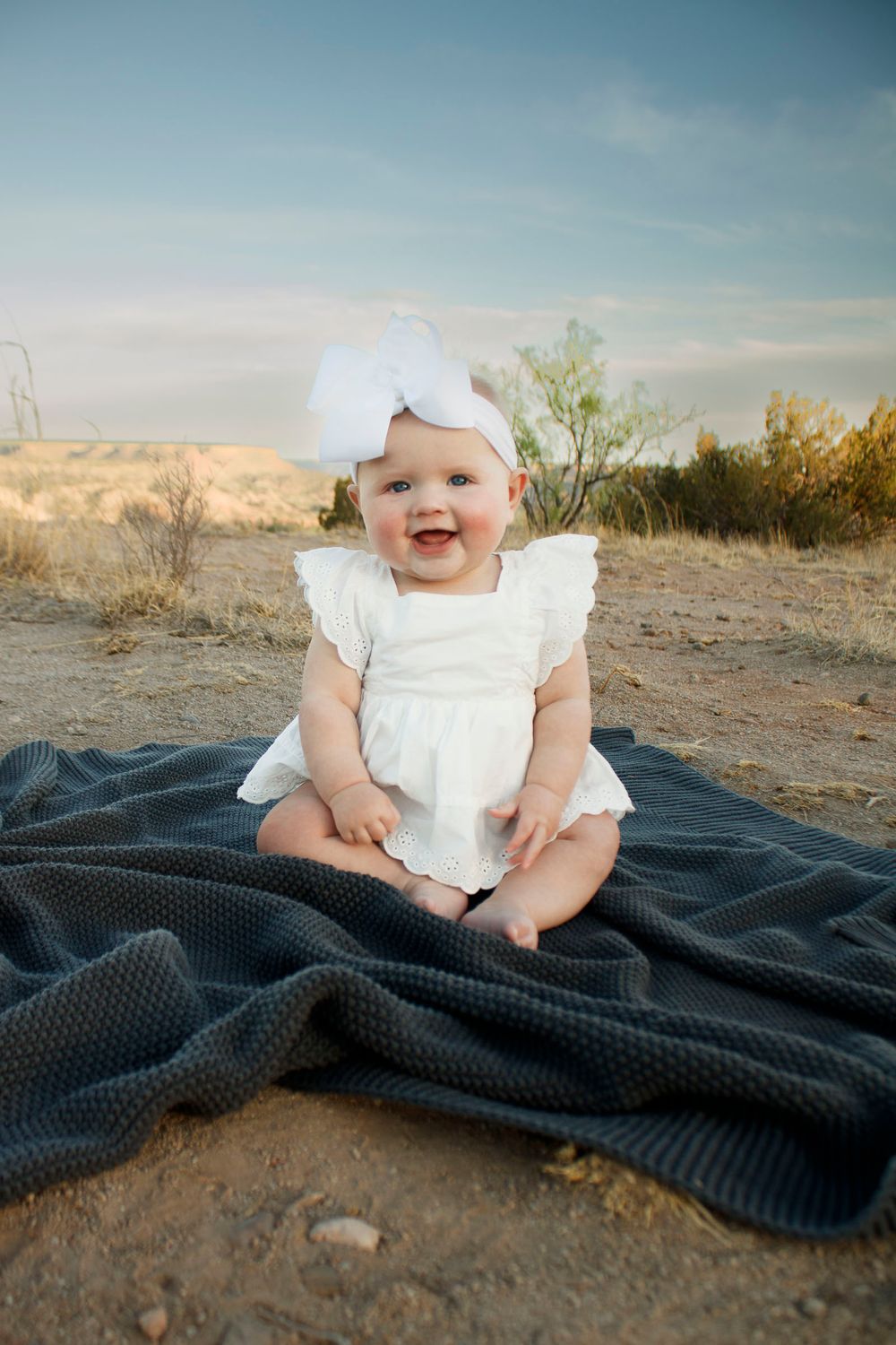 A baby girl during a family photo session at Palo Duro Canyon State Park in Canyon, Texas