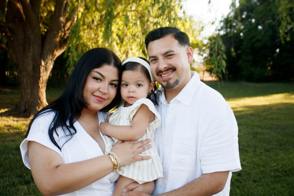 A family of three during a family photo session at Willow Tree Park in Canyon, Texas