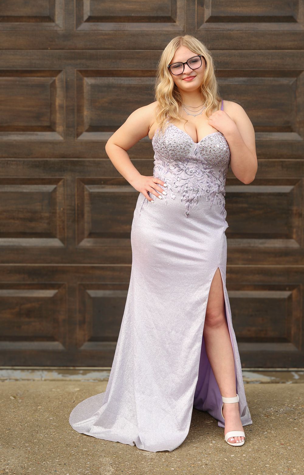 A sequence of photos showing someone in a sparkly silver formal dress posing playfully against a wooden wall.