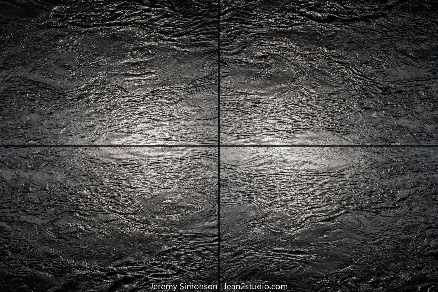 Dramatic lighting on rough stone wall texture with central seam.