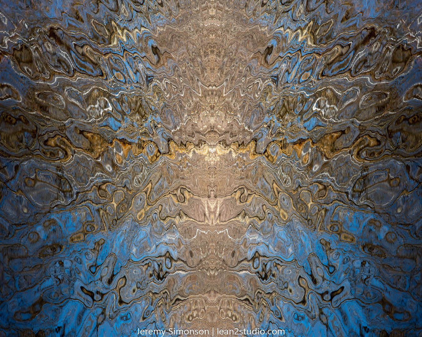 Abstract kaleidoscopic pattern in brown and blue tones creating an ethereal textured design.