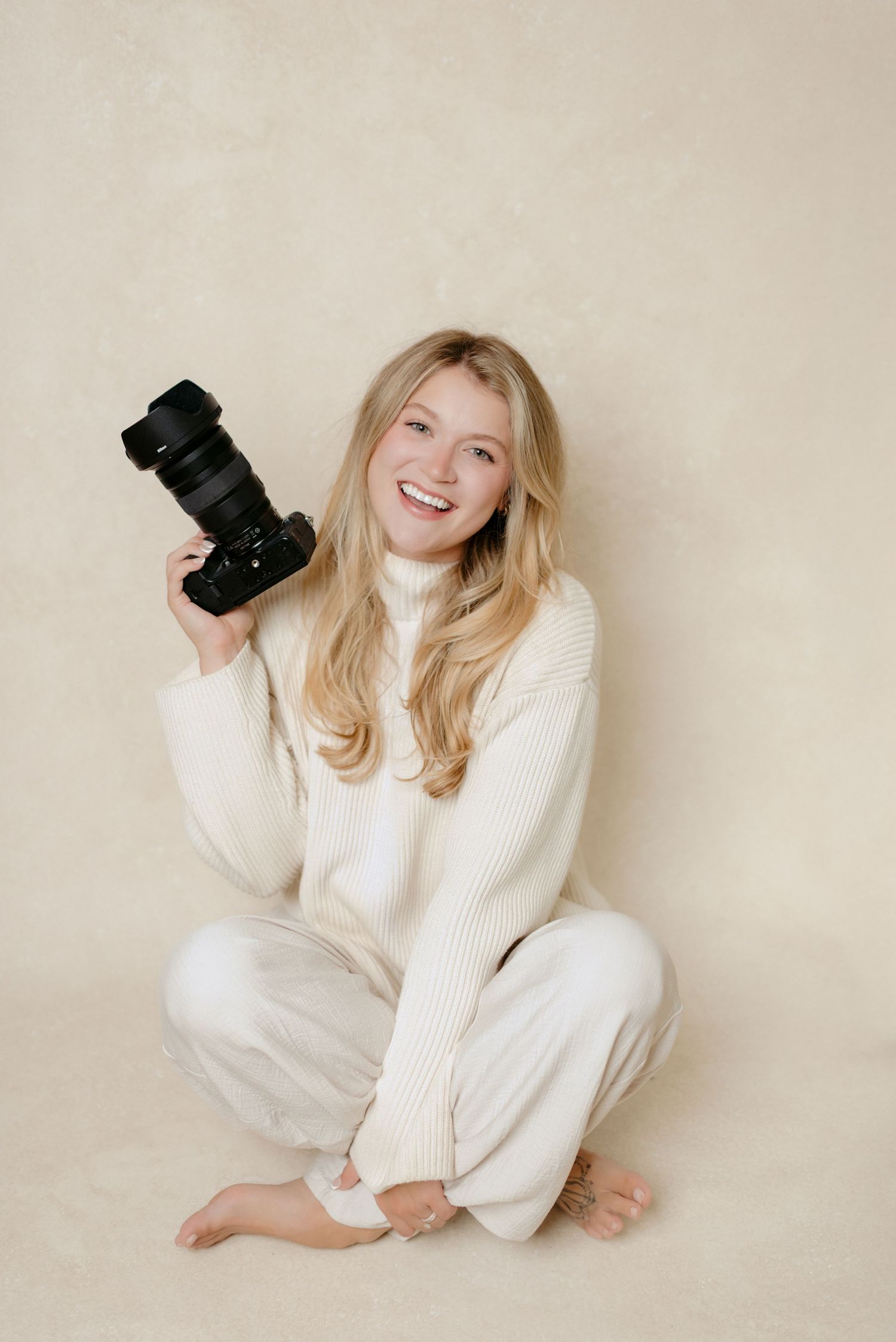 In studio headshot of Jagger Rose Photography in Hudson, Wisconsin