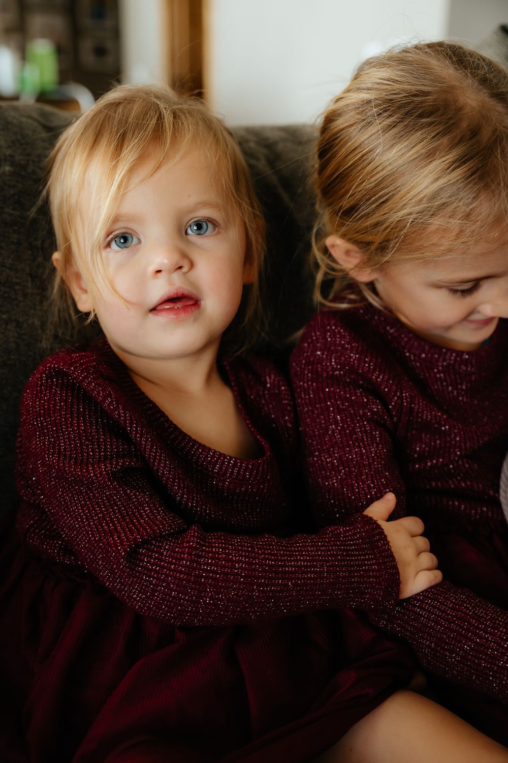 A series of artistic portrait shots showing a child in a burgundy sweater making playful expressions.