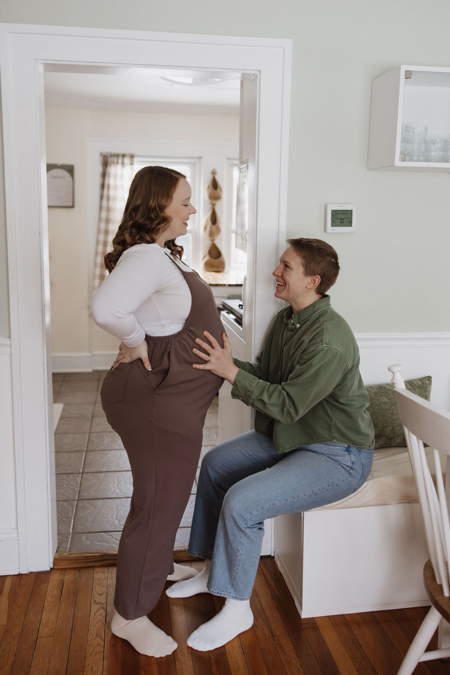 Family fall maternity photo session in Peninsula, Ohio in Cuyahoga Valley National Park candid, artistic, fun, happy, and unposed golden.