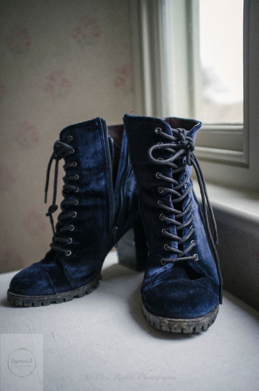 Reportage detail shot of brides wedding boots