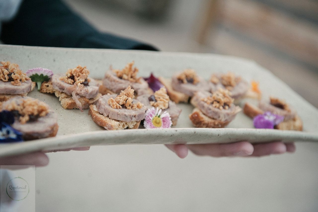 Reportage detail shot of wedding reception canapés being served