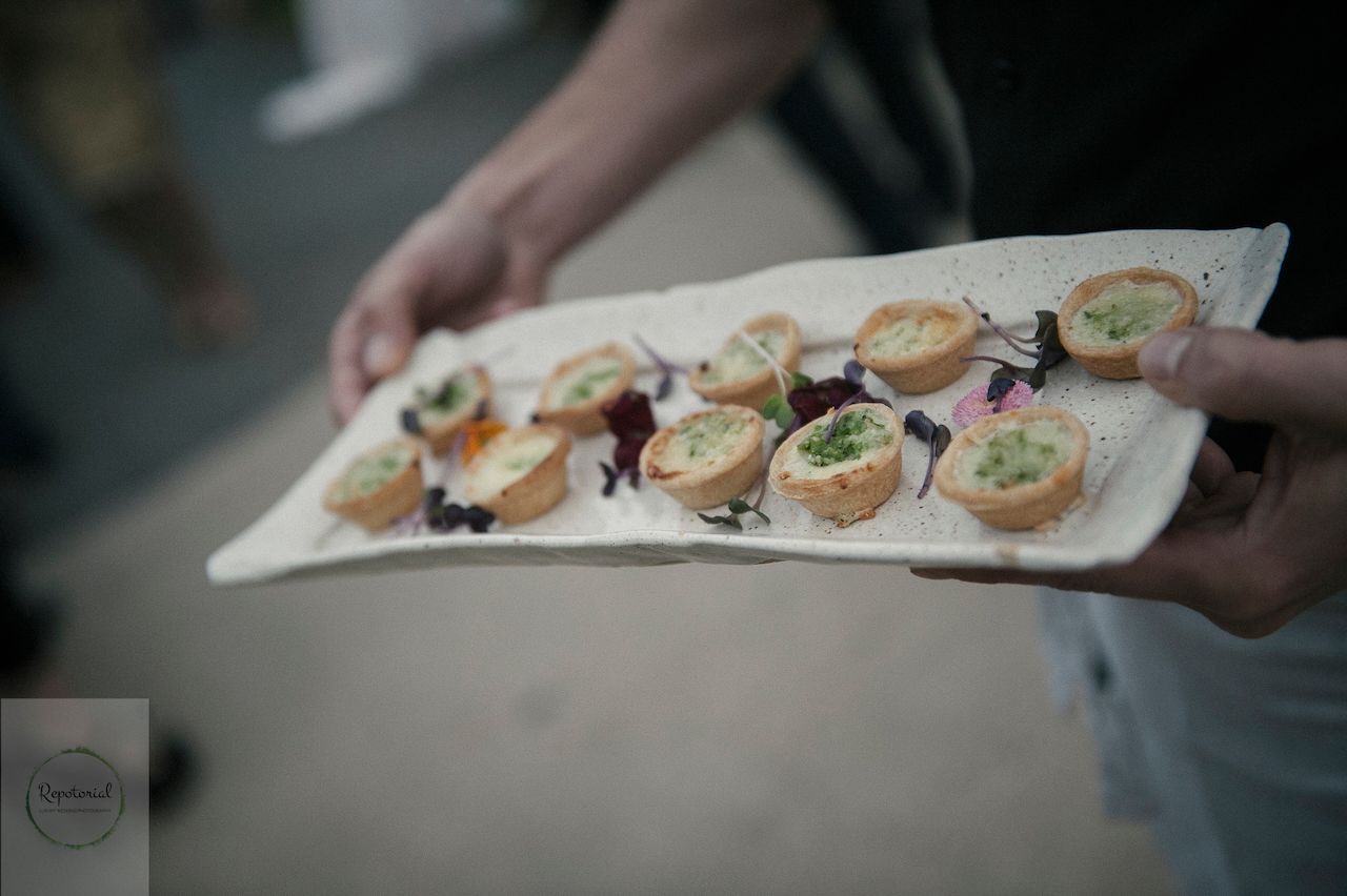 Reportage detail shot of wedding reception canapés being served